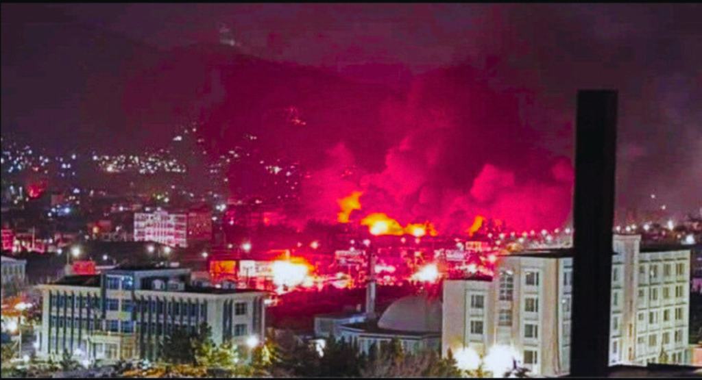 Kabul airstrike aftermath with destroyed structure and emergency responders