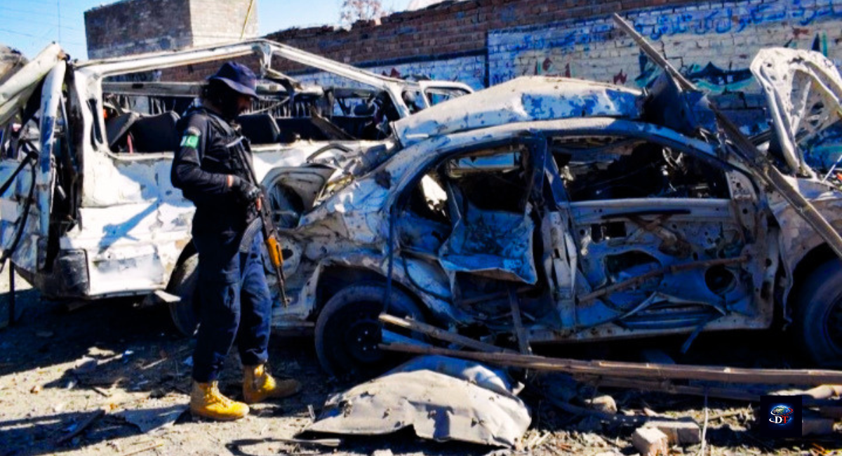 Image Title: Bannu Car Bomb Attack at Police Security Post Image Description: Security forces and rescue teams gather near the damaged checkpoint after the deadly Bannu car bomb attack in Khyber Pakhtunkhwa, Pakistan. Image Caption: Police and rescue officials inspect the blast site after the Bannu car bomb attack killed officers and injured civilians. Image Alt Text: Bannu car bomb attack destroys police security checkpoint